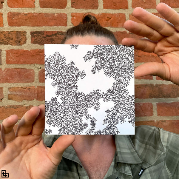 Photo of a human holding this specific LLLinked square. The lines of LLLinked are drawn by hand. Each square is 6"x6", cut, labeled, signed, and stamped by hand. Each LLLinked square has a unique QR code/RFID label. No two squares are the same. Owners can register and connect with other owners at LLLinked.art.