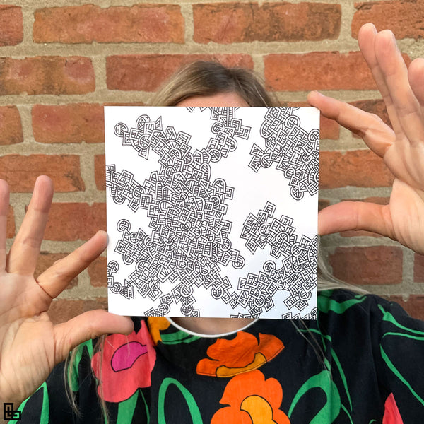 Photo of a human holding this specific LLLinked square. The lines of LLLinked are drawn by hand. Each square is 6"x6", cut, labeled, signed, and stamped by hand. Each LLLinked square has a unique QR code/RFID label. No two squares are the same. Owners can register and connect with other owners at LLLinked.art.